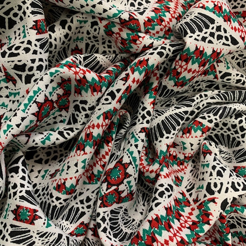 Red and Green Lace Look Print Rayon Challis Fabric